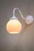 white gooseneck wall light with small opal shade