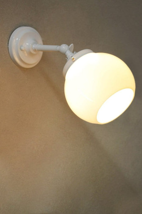 small adjustable white wall light with small opal shade
