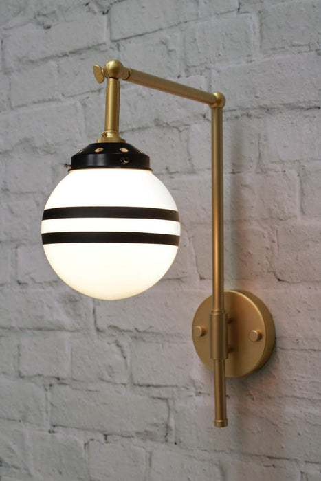 Gold wall sconce with 2 painted stripes