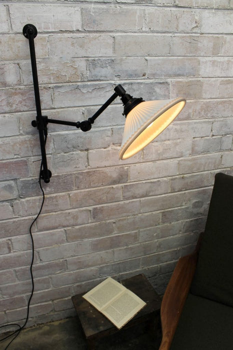 Swing arm wall light with ceramic shade and wall plug