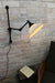 Swing arm wall light with ceramic shade and wall plug