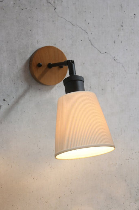Large ceramic shade on a wooden tiltable arm