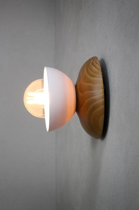 Wall light with white bakelite bowl shade and wood base