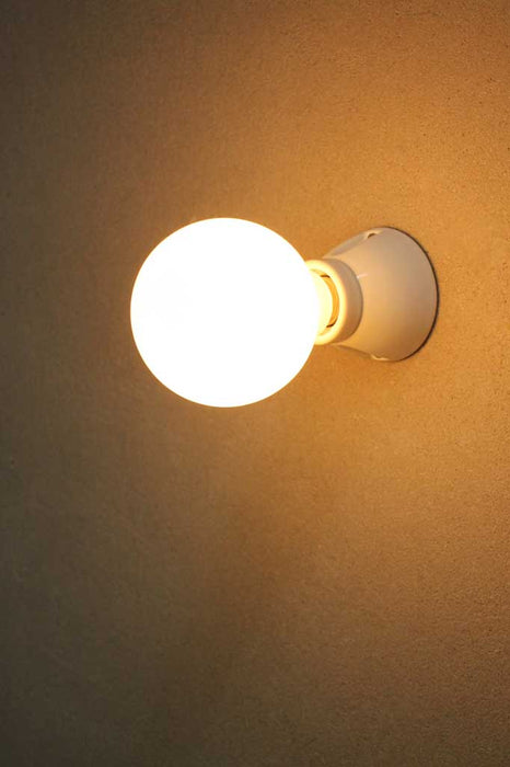 Wall sconce with bare bulb