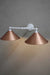 White double arm sconce with bright copper shades