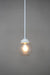 White pole pendant with small clear shade