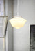 Small opal glass pendant light with round white cord