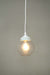 White round cord pendant light with small clear shade