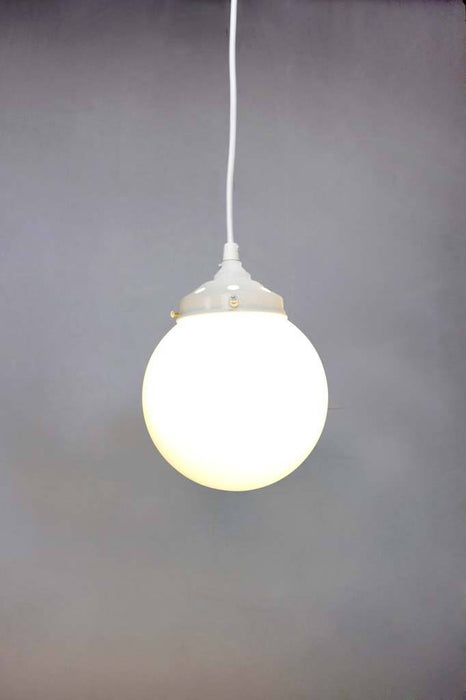 White round cord pendant light with small opal shade