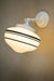 White wall light with small opal three stripe shade