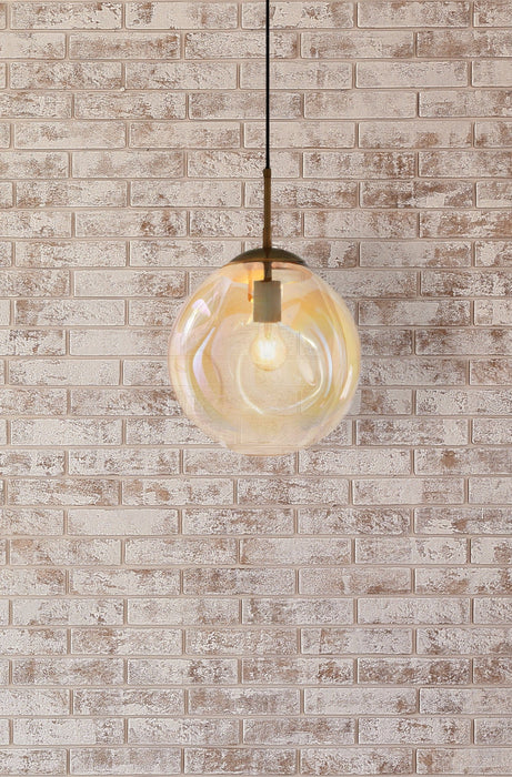 Large amber glass shade pendant on a white washed brick wall background