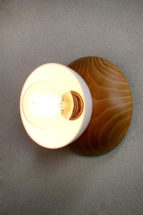 Wood base wall light with bakelite bowl shade in white