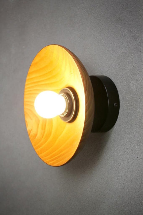 Wood wall light with black wall mount