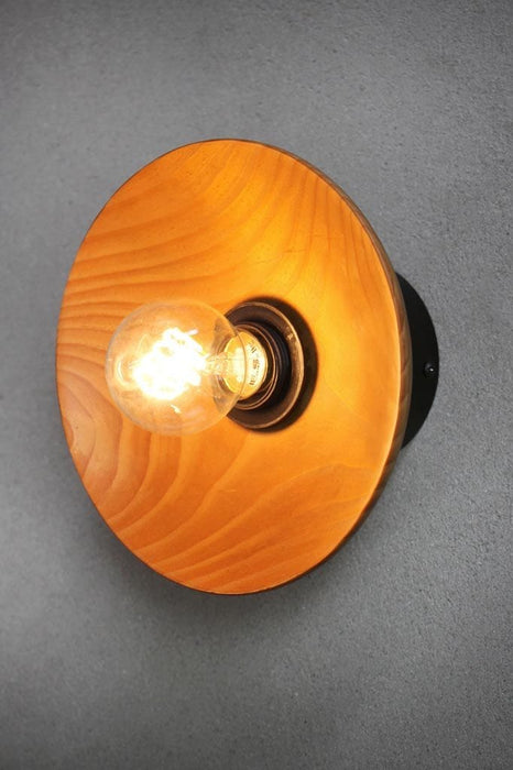 Wood wall light with small solid wood shade