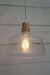Wood top glass light with teardrop squirell cage edison bulb