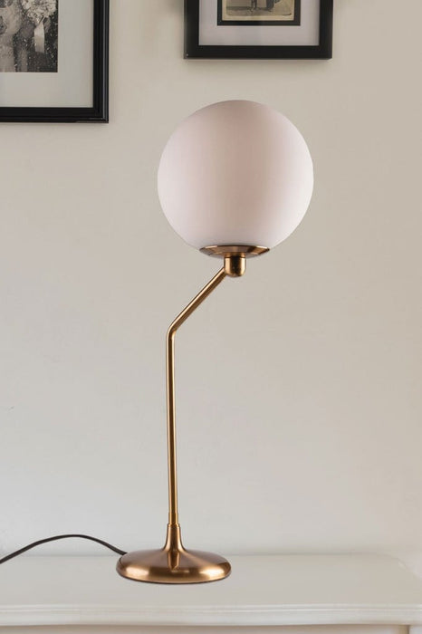 Art deco inspirated table lamp with aged brass metalware and frosted shade vintage lighting