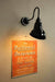 Black wall sign light versatile for both outdoor and indoor use.