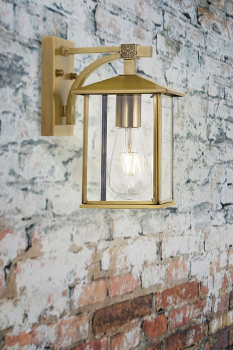 Modern brass wall light