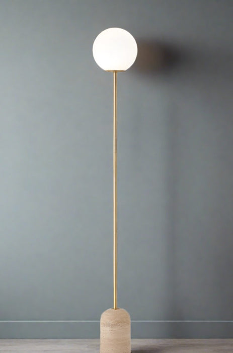 Floor lamp against textured wall 