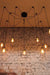 Cage industrial pendant light comes with ceiling plates to support cords draped hung or spread in different combinations