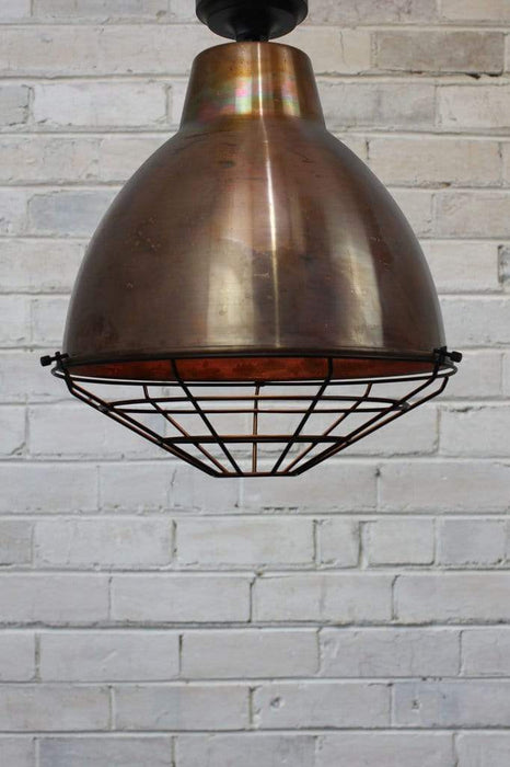 Ceiling light with copper shade black cage guard black