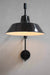 Classic black shade meets modern style of wall light