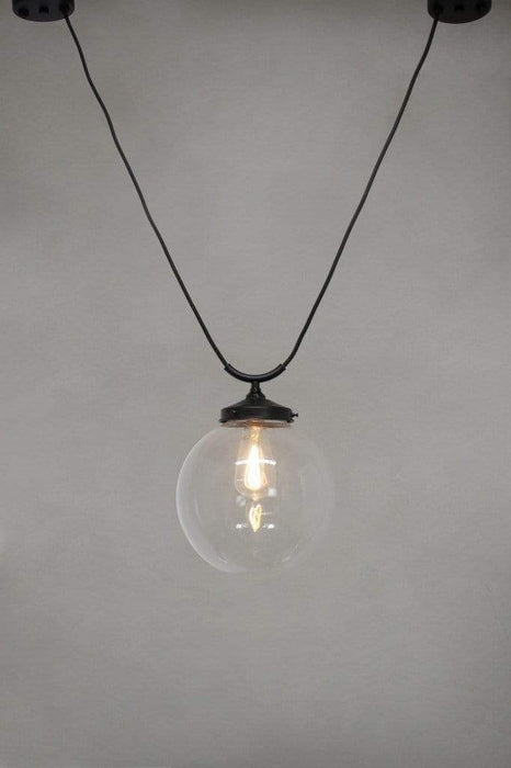 Medium round clear glass shade with trapeze pendant cord