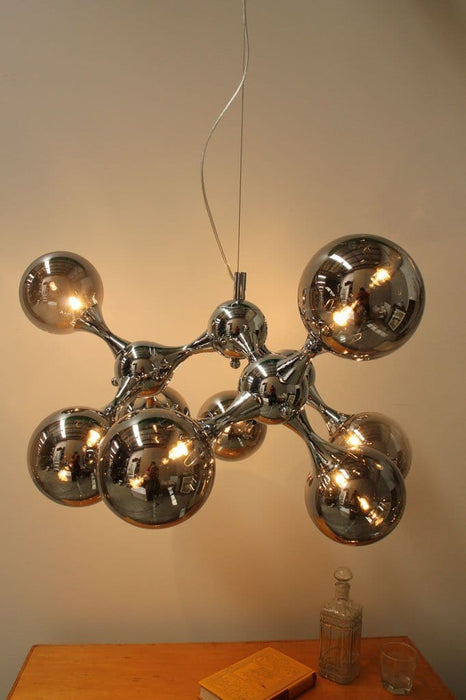 Contemporary sculptural light fitting has been influenced by the molecule chandeliers of the swinging sixties