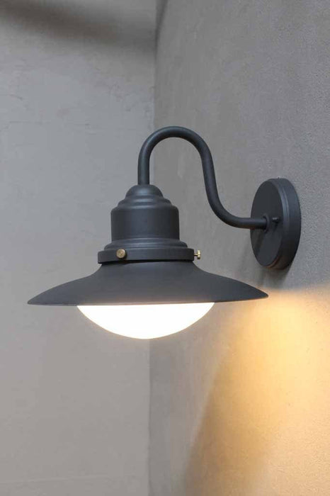 Exterior outdoor wall light in graphite. steel body with glass shade ideal for patio verhandahs or bbq areas