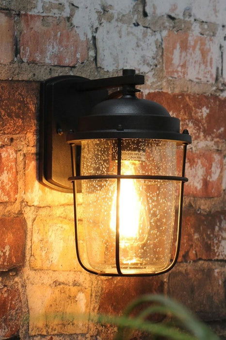 Small black steel outdoor wall light for front porch