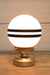 glass ball lamp with gold/brass base and 2 stripes