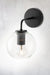 Glass wall light with black wall sconce