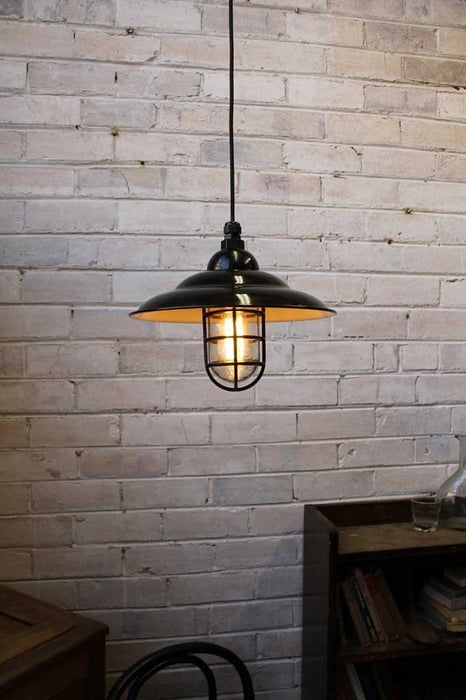 Industrial bunker pendant light used as cafe lighting in cafe interior