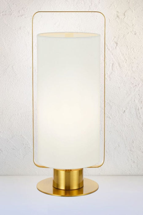 Mid-century style lamp with gold base and fixtures with ivory fabric cylindrical shade