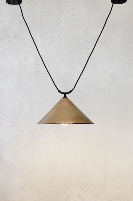 Large brass cone shade on trapeze pendant