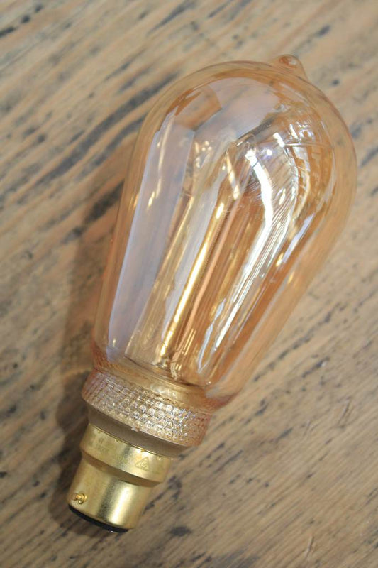 Laser-cut filament amber teardrop LED bulb off