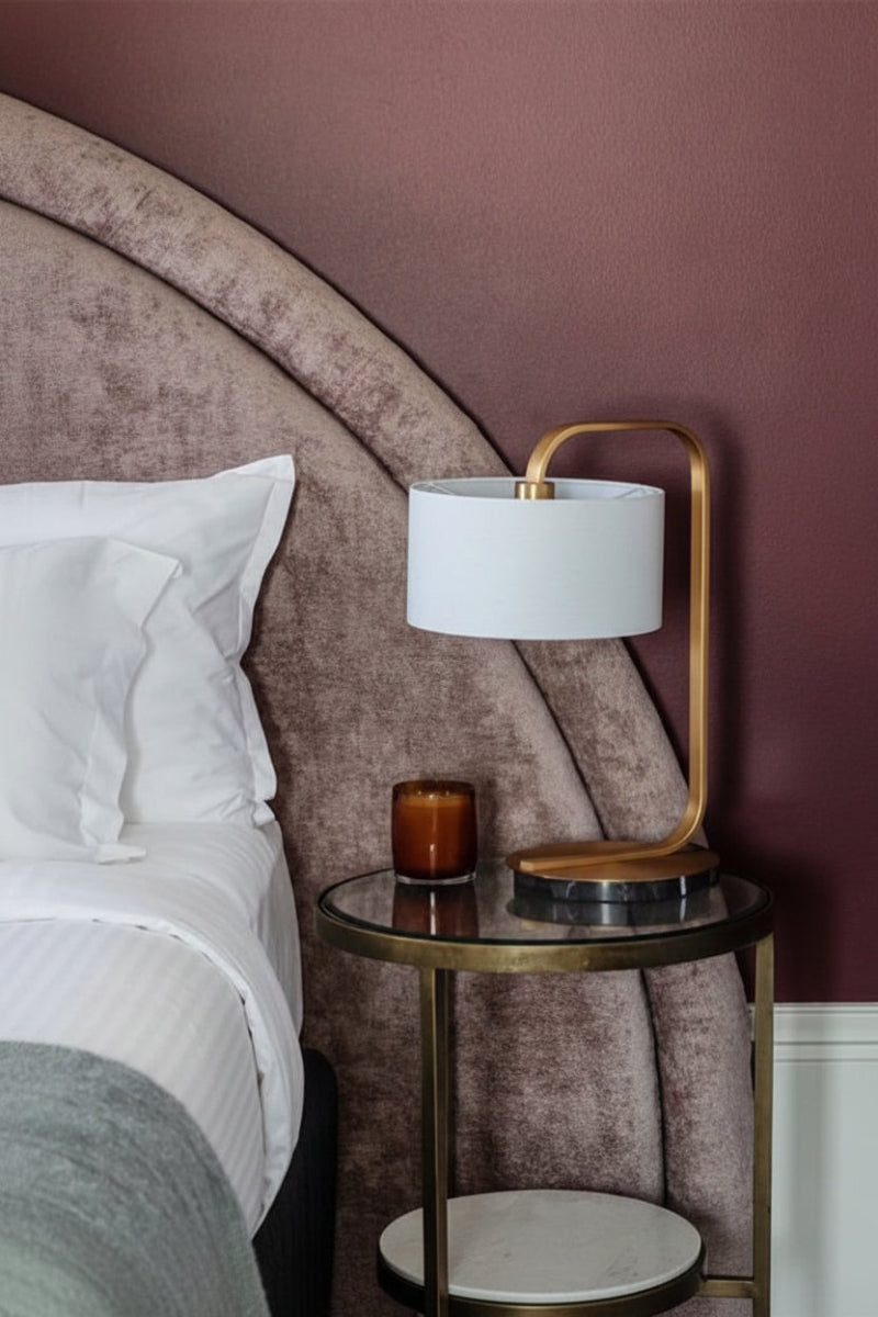 Black and gold table lamp in bedroom