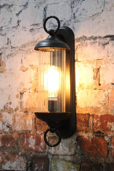Long black wall light with glass cover ideal for bathroom lighting in the home or business