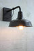 Light shade made from steel with a straight arm wall sconce