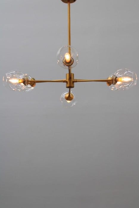 Six light chandelier with gold finish