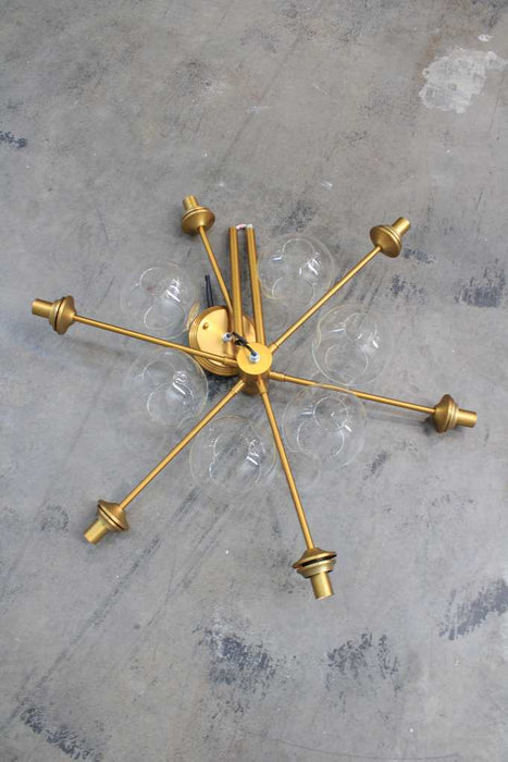 Disassembled six light chandelier in gold