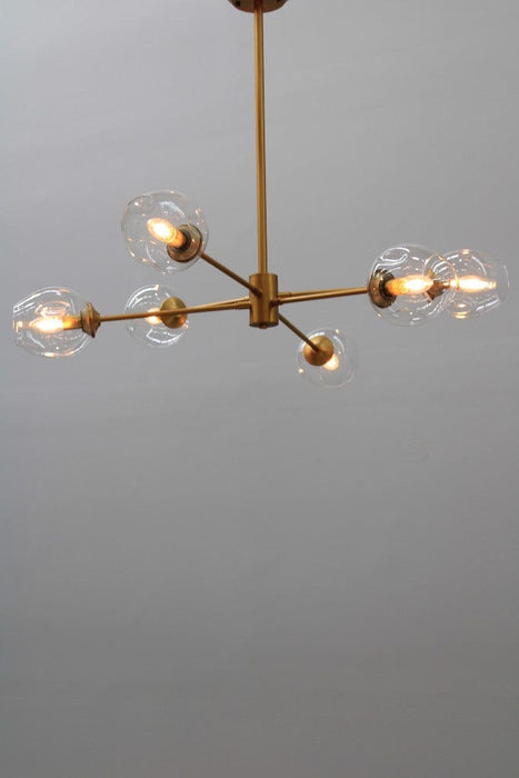 Six light chandelier with gold finish