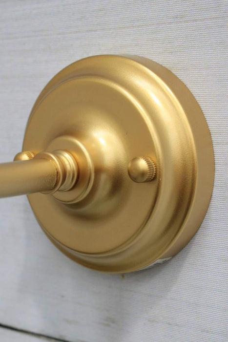 Gold wall sconce fixture detail