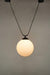 Large round opal glass shade with trapeze pendant cord