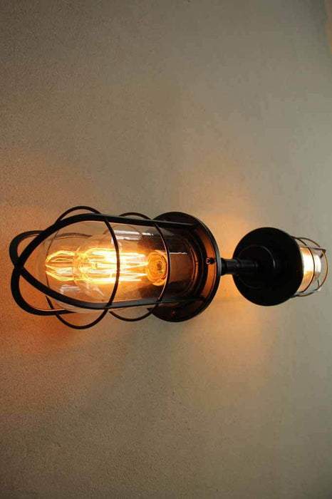 Outdoor wall light with edison bulb has nautical styling