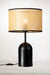 Table lamp with rattan shade and black base