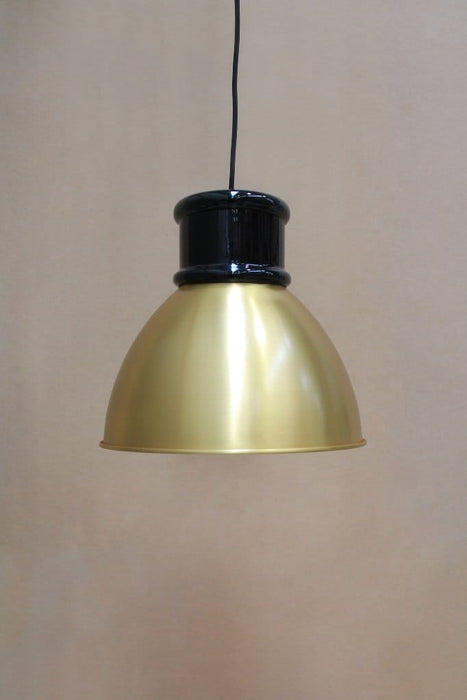 Bright brass shade with short black cover