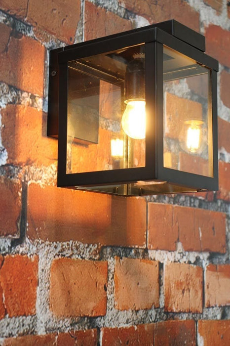 Square outdoor wall light with steel frame and glass panels