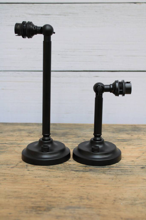 Black steel wall sconces in two sizes