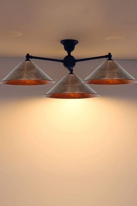 Three light copper light large shades